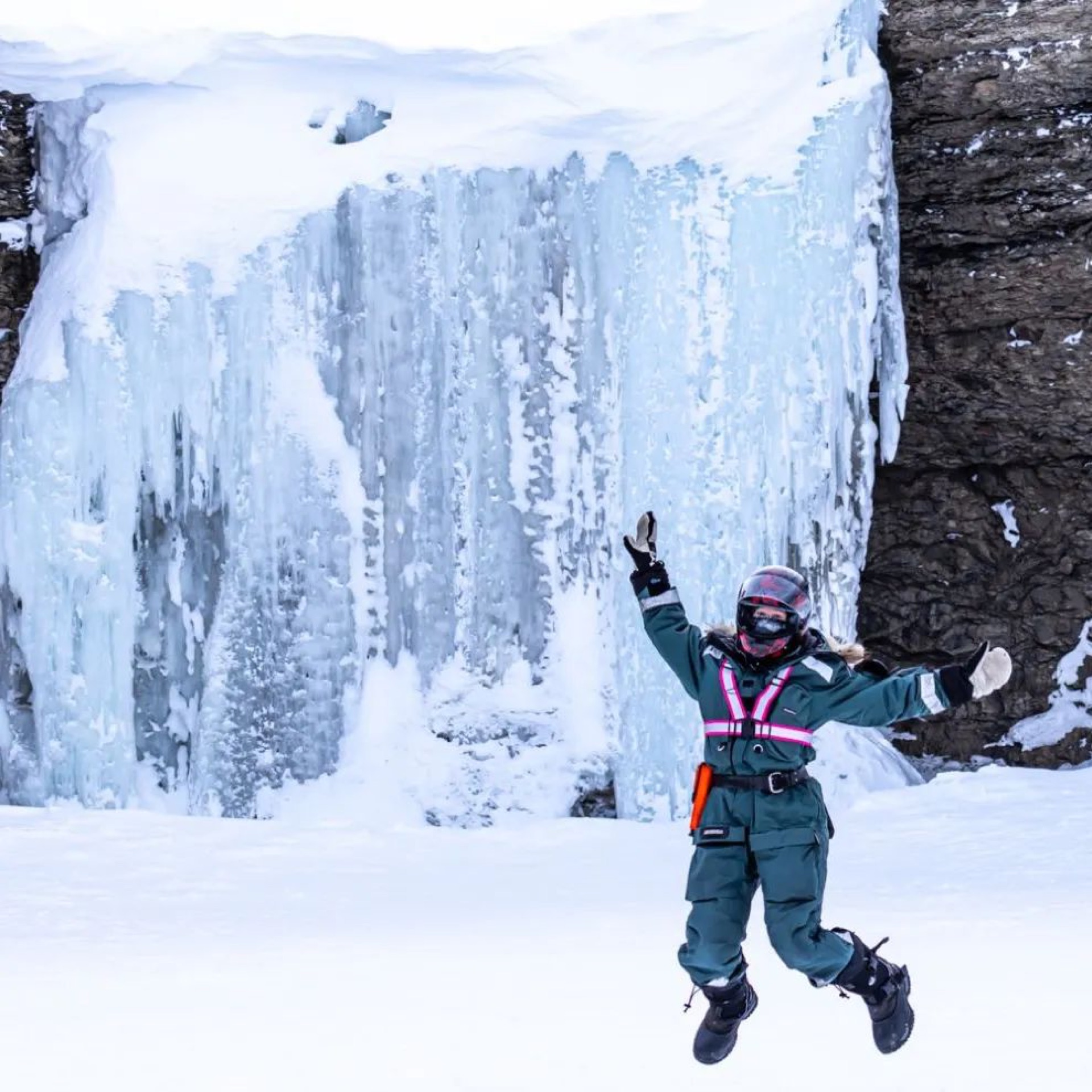 Guide in front of a frozen glacier ice wall, Svalbard